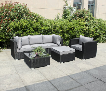 Polyrattan Gartenmöbelset mit 4 Sitzen mit Einzelsitz, Hocker, Tisch mit Glasplatte