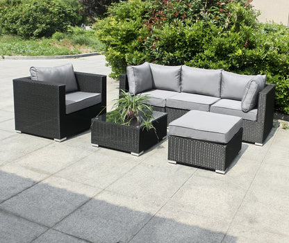 Polyrattan Gartenmöbelset mit 4 Sitzen mit Einzelsitz, Hocker, Tisch mit Glasplatte